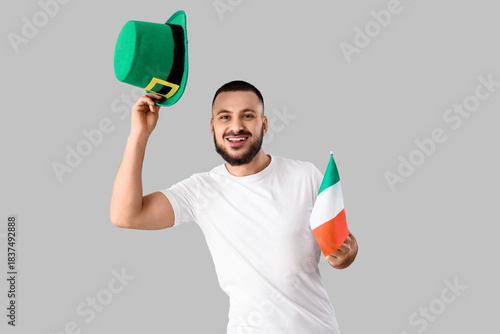 Young man with flag of Irel...