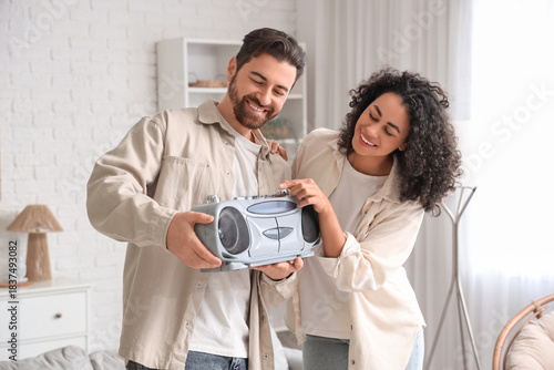 Young couple with boombox a...