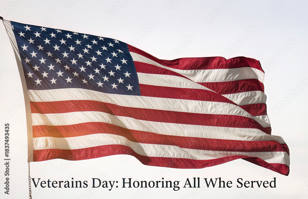 Obraz premium A magnificent American flag, sharp red and white stripes and a constellation of brilliant white stars on a deep blue canton.Prominently centered, is the phrase 'Veterans Day: Honoring All Who Served'.
