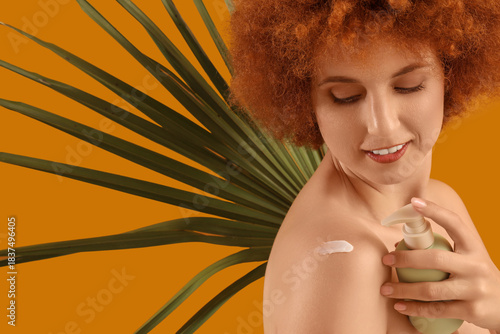 Young redhead woman with pa...