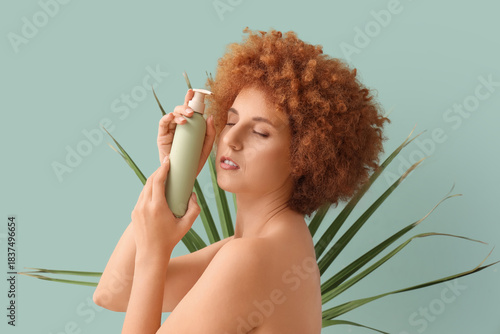 Young redhead woman with bo...