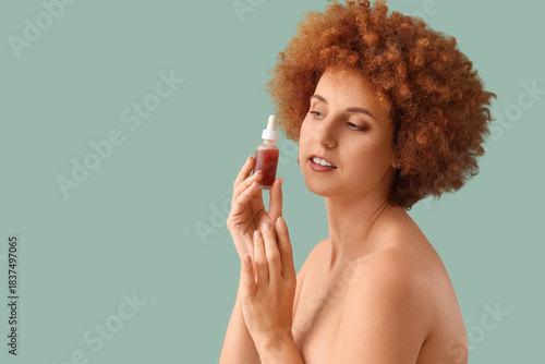 Young redhead woman with na...