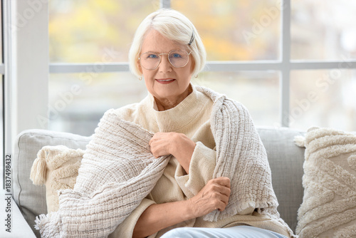 Senior woman in eyeglasses ...