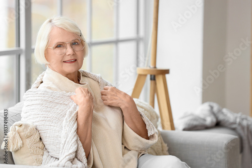 Senior woman in eyeglasses ...