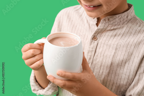 Cute little boy with cup of...