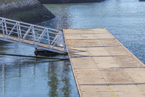 Photography Floating dock and gangway meeting calm harbor water