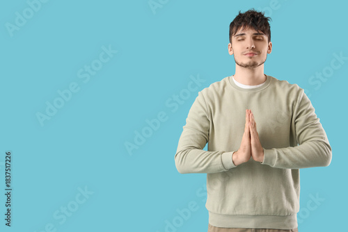 Handsome young man meditati...