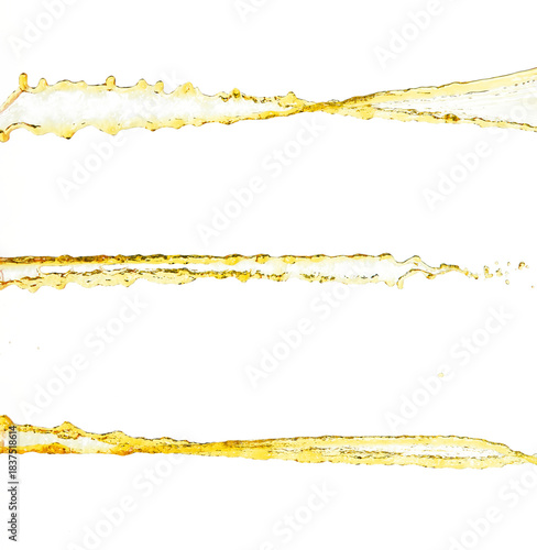 Orange, lemon juice or oil lubricant splash, liquid gold yellow drink drops. Fruit beverage water elements in line form . Fresh splashing and flowing jets, white background isolated freeze motion