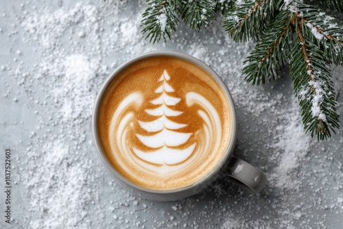 Overhead view captures hot beverage featuring holiday tree design amidst winter elements