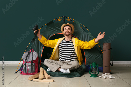 Young male tourist with ten...