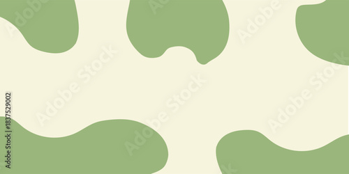 Abstract light green and cream cow print pattern background with organic shapes.