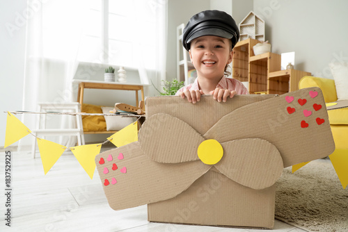 Cute little girl with pilot...