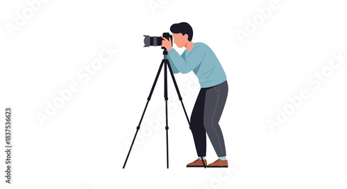 Photographer capturing a moment with camera on tripod focused and ready.