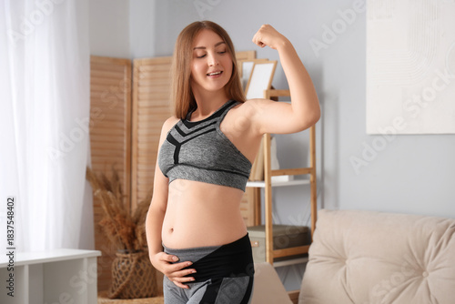 Sporty young pregnant woman...