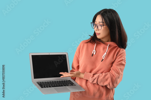 Young female Asian programm...