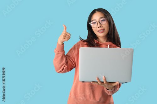 Young female Asian programm...