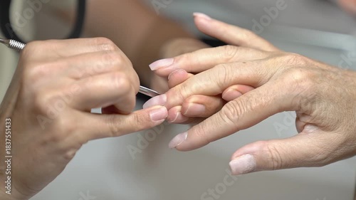 Step-by-step Guide to Classic French Manicure Using Modern Tools. Cuticle treatment with cuticle pusher