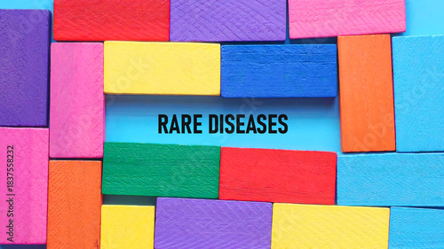 Konstfotografi Colorful Wooden Blocks Framing Rare Diseases Concept on a Bright Blue Backgrou