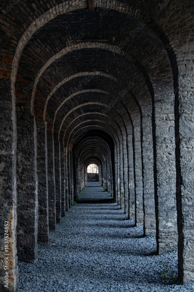 Fototapeta premium The profound beauty of the ancient arched corridor