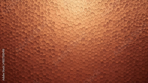 Close-up view of a hammered copper surface with a textured, dimpled pattern and warm metallic sheen.
