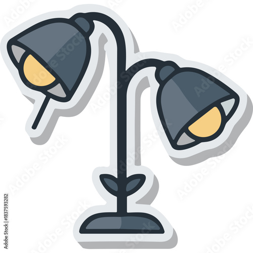 Modern Dual Headed Desk Lamp With Warm Yellow Lights On A Sturdy Base With A Central Stem Adorned With Leaf Motifs In A Dark Gray Finish