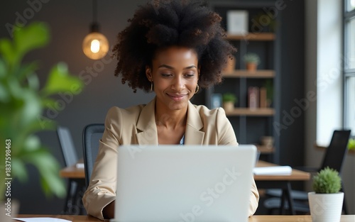Laptop, business and portrait of black woman in office for research, website or designer. Thinking, creative and internet with female employee in digital agency for technology, email and entrepreneur