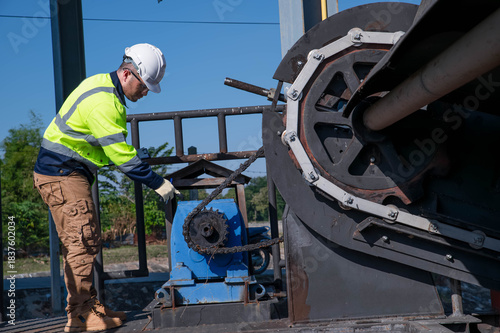 Quadro su tela A wastewater treatment plant engineer is inspecting the wastewater treatment plant's sump pump for damage