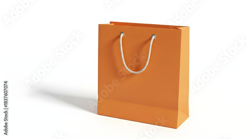 Bright orange paper shopping bag with white rope handles, isolated on a white background with shadow.