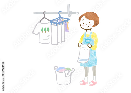 洗濯物を干しているエプロン姿の女性のイラスト