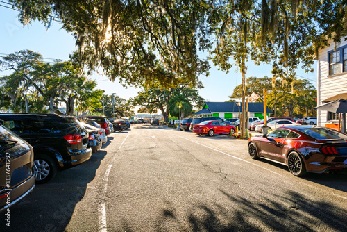 Fototapeta Naklejka Na Ścianę i Meble -  The picturesque, tree lined Main Street of cafes along the Grand Strand Intracoastal Waterway at the small town of Little River, South Carolina.