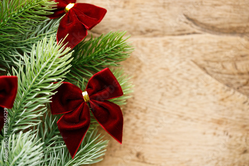 Red ribbons with pine branches, Christmas tree concept.