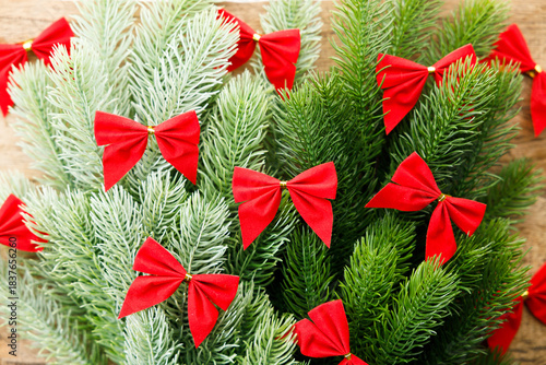 Red ribbons with pine branches, Christmas tree concept.
