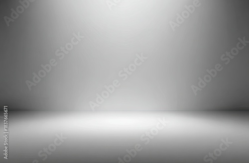 Minimalist gray gradient studio background with light reflecting from floor