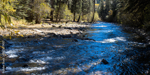 The Pecos River flows from its headwaters through Pecos River Canyon State Park toward the town of Pecos, New Mexico