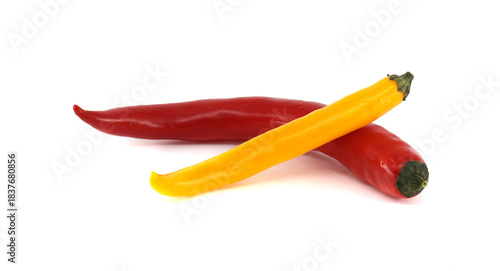 Red and yellow chili peppers creating a colorful contrast on white background