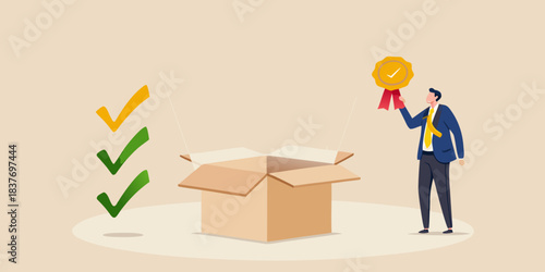A man presenting a golden award emerging from an open cardboard box