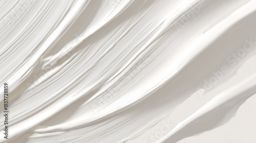 Abstract, textured brush strokes create a minimalistic background. The colors are smooth and fluid, using light and shadow, the colors of the Cloud Dancer's year.