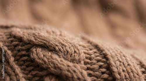 Close up of brown cable knit wool fabric texture image