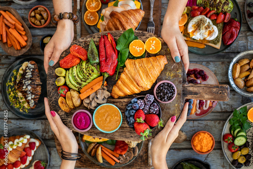 Croissant sandwich filled with ham, bacon, cheese and salad.  crowich