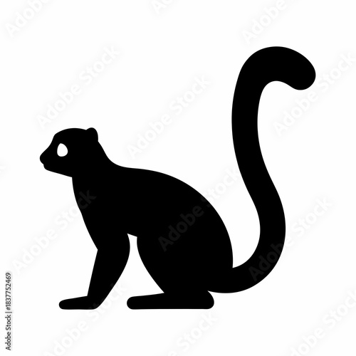 Silhouette of a black arboreal mammal with a long prehensile tail