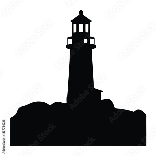 Monochrome lighthouse silhouette on rocks conveying nautical coastal scenery at seaside