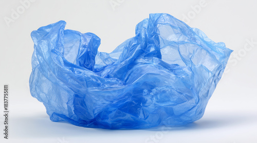 Blue plastic bag isolated on white background. Simple object shot representing packaging, retail use, waste concept, and environmental pollution issues.