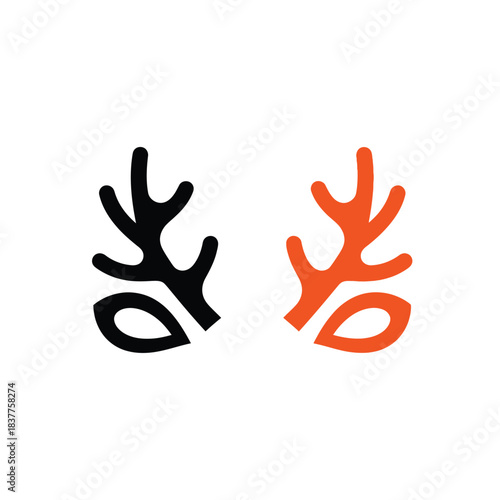 this image presents a striking visual contrast with two antler like shapes one rendered in black and the other in a vibrant orange hue creating