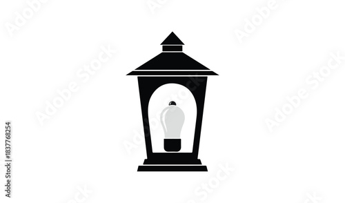 Classic black outdoor lantern with a light bulb inside