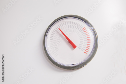 Analog gauge with red arrow of water heater boiler on white background
