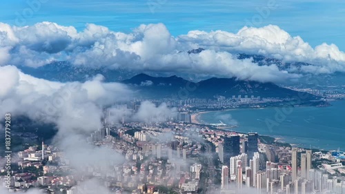 Benidorm Coastal City Aerial View Through Clouds
