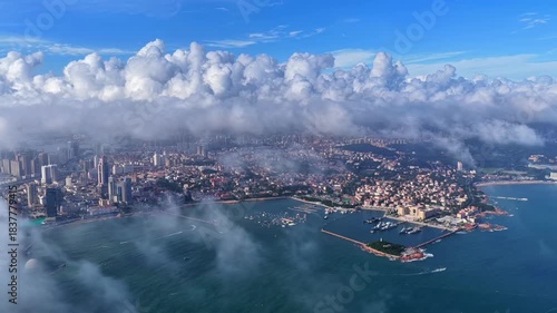 Qingdao Aerial View with Clouds and Coastal Harbor