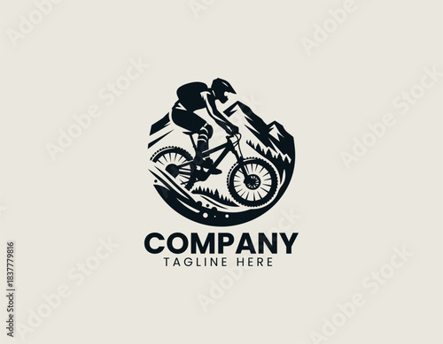 Mountain biker silhouette riding rugged trail in dynamic black vector logo illustration
