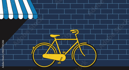 A vibrant yellow bicycle stands parked against a textured dark blue brick wall, illuminated by an unseen light source under a striped awning, capturing urban life.