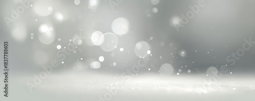 Minimalist winter festive background with platinum bokeh lights and floating particles on soft pale gray gradient for holiday banner ad copy space layout

